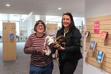 Library staff with bunnies at Easter at the Library 2022
