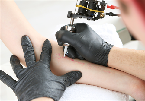 Image of someone getting a tattoo