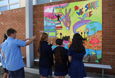 Students admire the Mural
