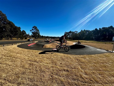 Rider on pump track at Murraural 4K Playspace - David Wood Playing Fields 2