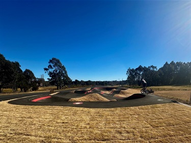 Rider on pump track at Murraural 4K Playspace - David Wood Playing Fields 3